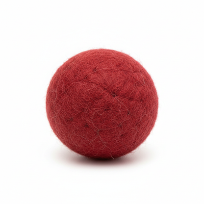Close-up macro shot of red felt wool cat ball showing texture detail