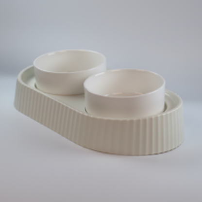 45-degree side angle view of double ceramic pet bowl set showing bowl depth and tray profile