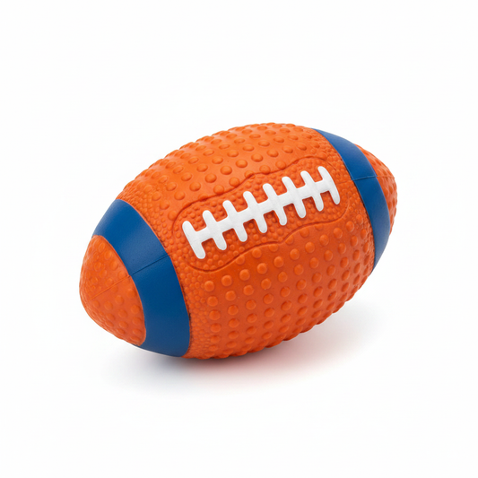 Rugby ball shaped rubber dog toy in orange with blue stripe bands and bumpy texture
