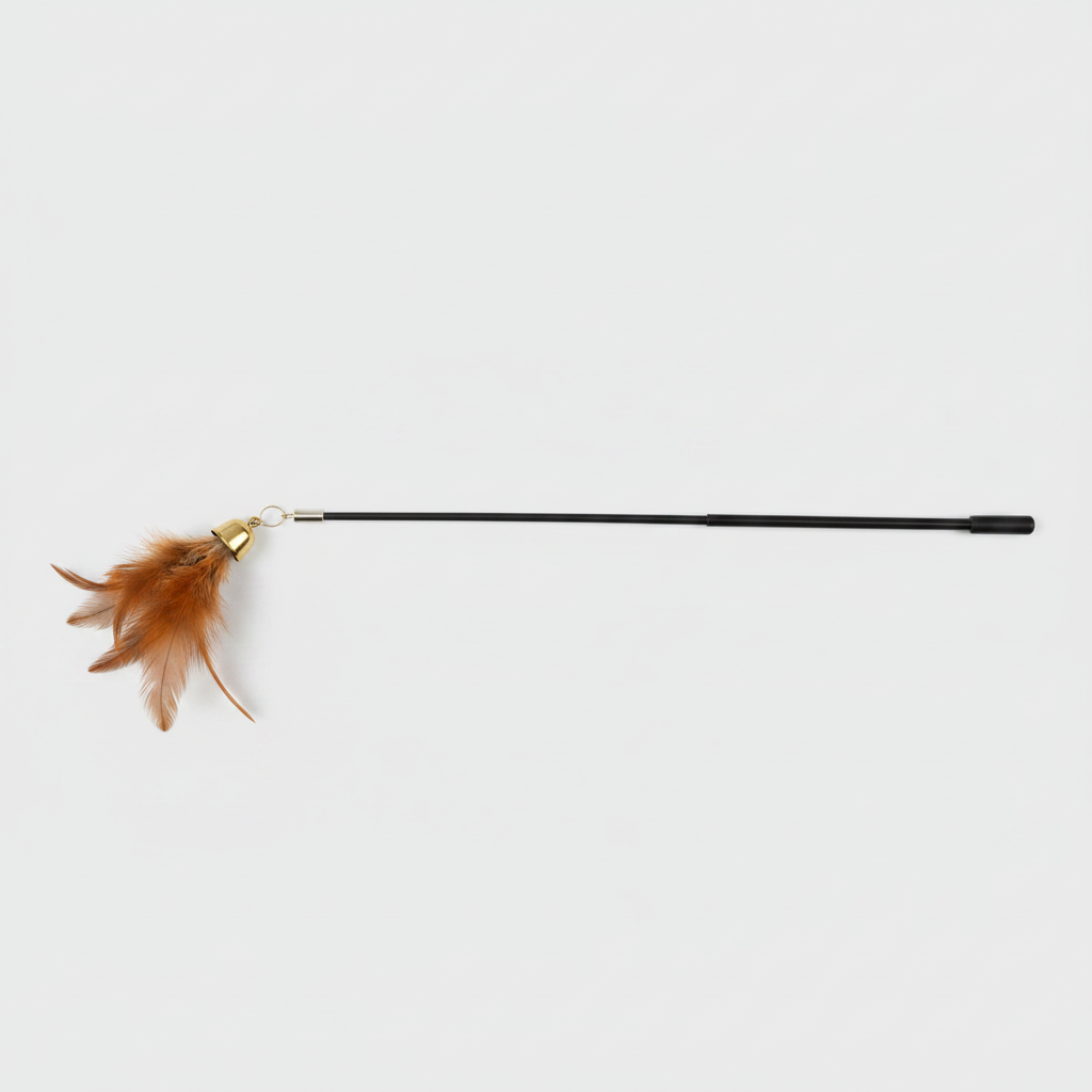 Top-down flat lay of cat teaser wand showing full rod length and feather tassel