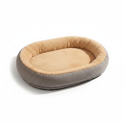 Oval bolster pet bed in gray suede with warm beige sherpa fleece interior
