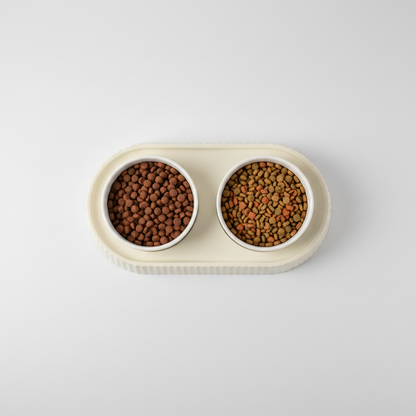 Top-down view of double ceramic pet bowl set showing both bowls in oval tray