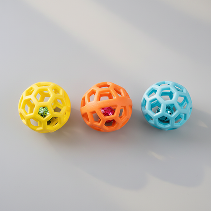 Three hollow lattice rubber pet toy balls in yellow, orange and sky blue grouped together